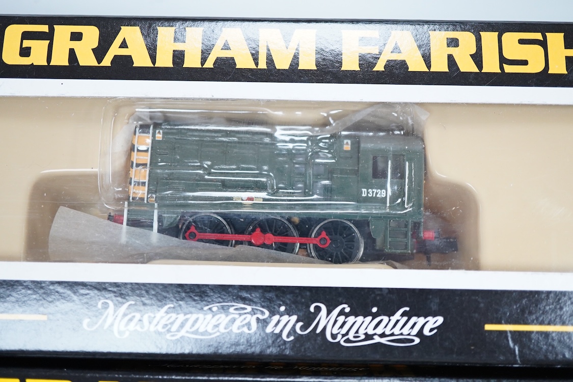 Four boxed Graham Farish N gauge railway Class 08 0-6-0 diesel locomotives; a BR, D3729 (371-001), a Railfreight Distribution, 08 653 (371-000), an EWS, 08957 (100F) and a Thomas 1, 08500 (1006).